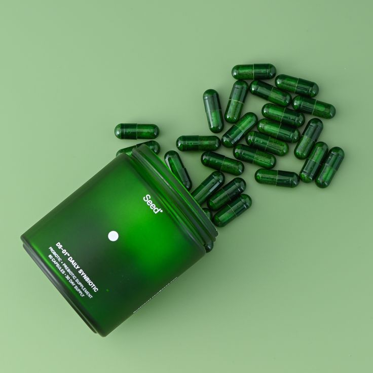 Green supplement capsules representing eligible wellness products