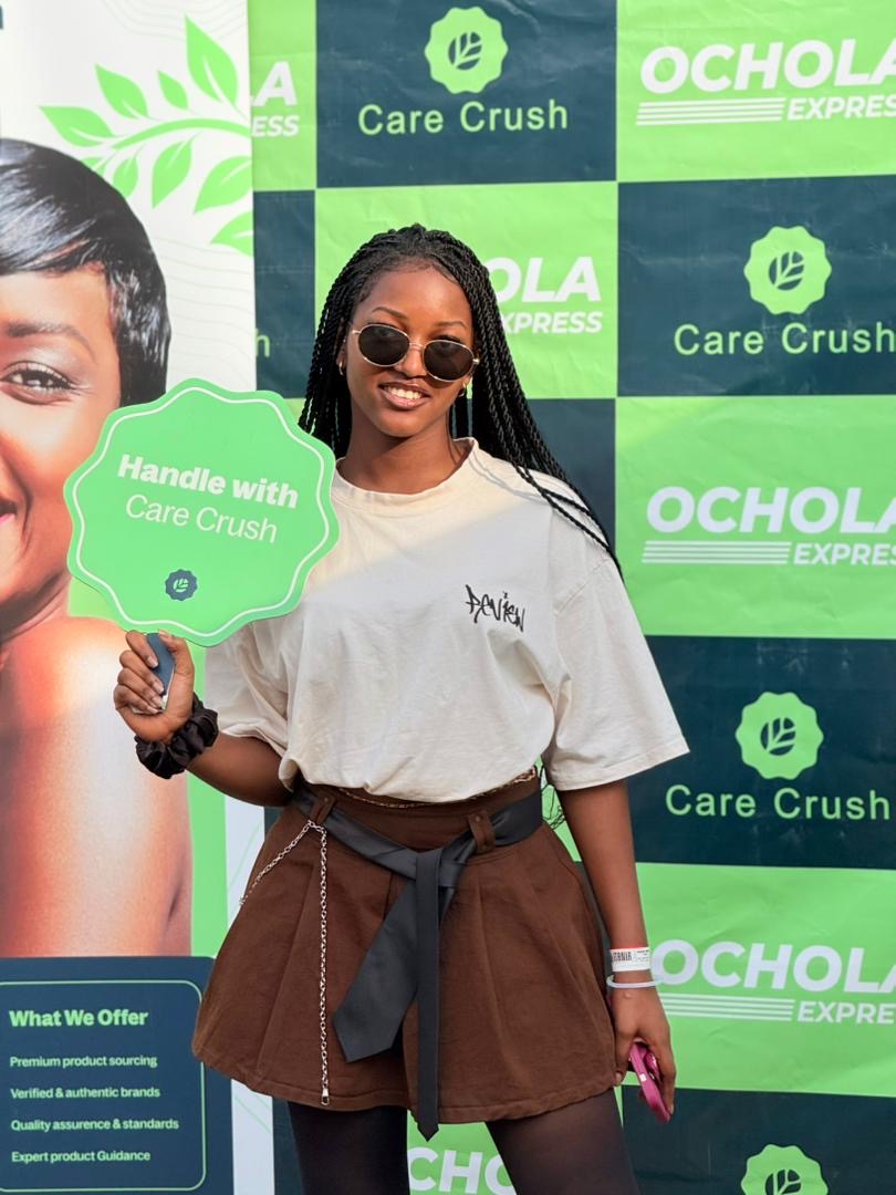 Care Crush community member holding a Handle with Care Crush sign at a branded event